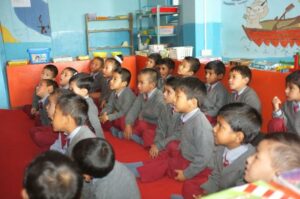Children in India listening to the teacher